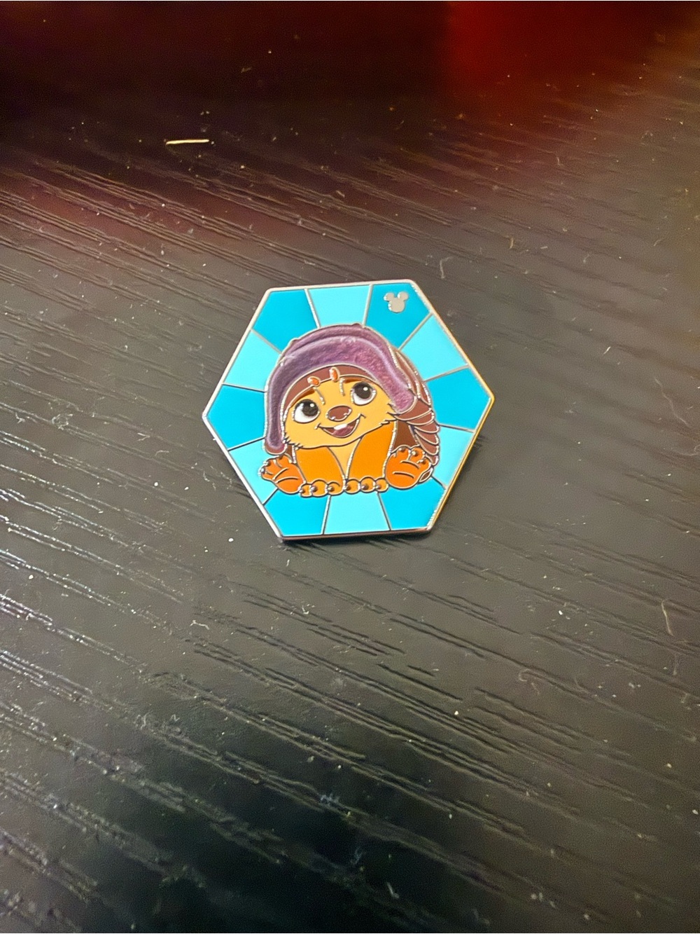 Disney Orange Character Enamel Pin with Teal Hexagon Background